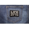 Life Begins at 70 Iron on Morale Patch shown on jeans