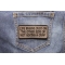 Life Begins Just On The Other Side Of Not Giving A Crap Iron on Morale Patch shown on jeans