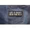 Life Is Short Break Some Rules Iron on Morale Patch shown on jeans