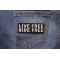 Live Free Ride Free Patch | Embroidered Patches Live Free Ride Free Patch shown on jeans