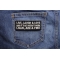 Live Laugh Love and If That Doesn't Work Load Aim and Fire Funny Iron on Patch shown on jeans