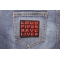Loud Pipes Save Lives Patch shown on jeans