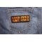 Loud Pipes Save Lives Patch shown on jeans