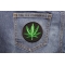 Marijuana Leaf Novelty Iron on Patch shown on jeans