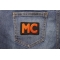 Orange MC Patch shown on jeans