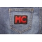 Red MC Patch shown on jeans