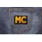 Yellow MC Patch shown on jeans