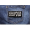 Never Forget First Pig Patch shown on jeans