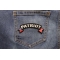 Patriot Rocker Iron on Patch With US Flag shown on jeans