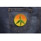 Peace Cannabis Leaf Iron on Hippie Patch shown on jeans