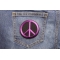 Peace Sign Patch Purple On Black shown on jeans