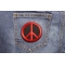 Peace Sign Patch Red On Black shown on jeans