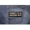 Property Of An Awesome Wife Funny Iron on Patch shown on jeans