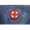 Red and Black Cross Medic Patch shown on jeans