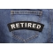 Retired Patch shown on jeans