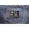 Say No To Bullying Blue Ribbon Patch | Embroidered Patches Say No To Bullying Blue Ribbon Patch shown on jeans