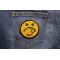 Shit Smiley Face Patch shown on jeans