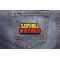 Sleeps Well With Others Patch | Embroidered Patches Sleeps Well With Others Patch shown on jeans