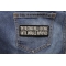 The Beatings Will Continue Until Morale Improves Patch shown on jeans
