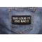 Too Loud Too Bad Patch shown on jeans