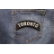 Toronto City Patch shown on jeans