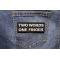 Two Words One Finger Patch Two Words One Finger Patch shown on jeans