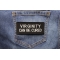 Virginity Can Be Cured Patch shown on jeans