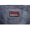 Warning Bombshell Patch | Embroidered Patches Warning Bombshell Patch shown on jeans