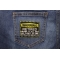 Warning Retired Knows It All Funny Iron on Patch shown on jeans
