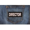 Director Patch shown on jeans