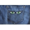 Iron on Green Eye Patches shown on jeans