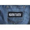 Heavens to Betsy Funny Iron on Patch shown on jeans