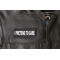 I Pretend to Care Patch - 4x1.5 inch - Embroidered Iron on Patch shown on leather vest