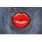 Lips Blowing a Kiss Iron on Patch shown on jeans
