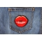 Kissing Lips Small Iron on Novelty Patch shown on jeans