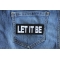 Let It Be Patch shown on jeans