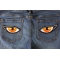 Medium Orange Eyes Patch Medium Orange Eyes Iron on Patch shown on jeans