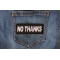 No Thanks Patch shown on jeans