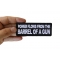 Power Flows From the Barrel of a Gun Funny Iron on Patch shown on hand for size comparison