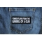 Power Flows From the Barrel of a Gun Funny Iron on Patch shown on jeans