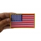 US Flag Patch 4 Inch Yellow Border shown on hand for size comparison