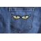 Yellow Eyes Iron on Patch shown on jeans