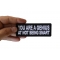 You are a Genius At Not Being Smart Funny Iron on Patch shown on hand for size comparison