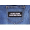 Cuter Than Your Girlfriend Funny Iron on Patch shown on jeans