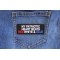 My Patriotic Heart Beats Red White and Blue Iron on Patch shown on jeans