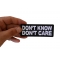 Don't Know Don't Care Funny Iron on Patch shown on hand for size comparison