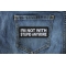 I'm Not With Stupid Anymore Funny Iron on Patch shown on jeans