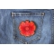 Red Orange Flower Patch Red Orange Flower Iron on Patch shown on jeans