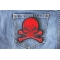 Red Skull and Cross Bones Biker Patch shown on jeans