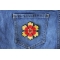 Red Yellow Flower Patch Red Yellow Flower Iron on Patch shown on jeans